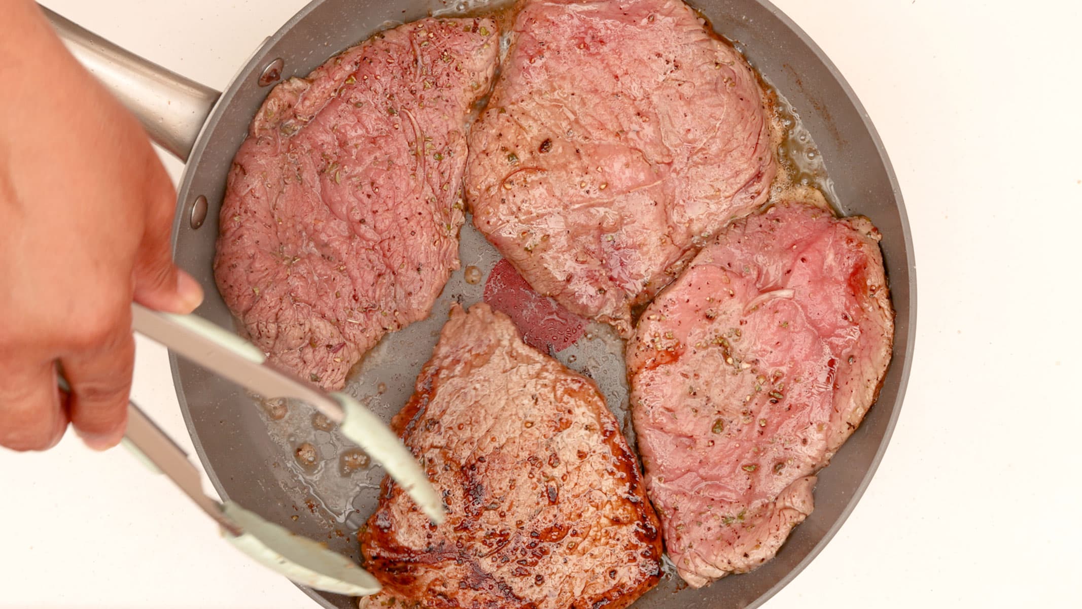 Cooking the steaks.