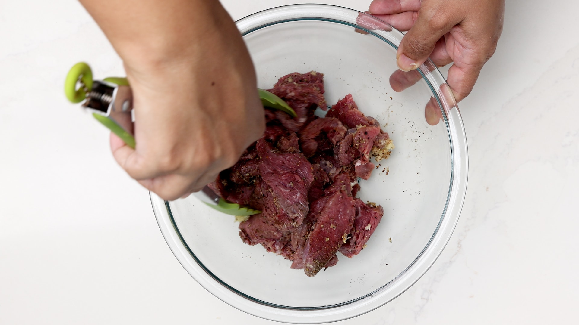 Seasoning the meat.