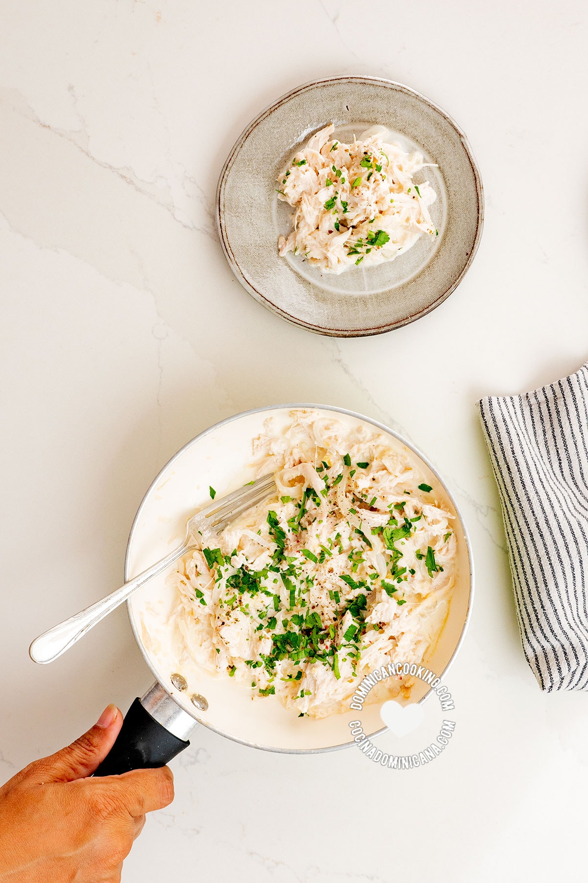 Creamy chicken in handheld pan and on plate.