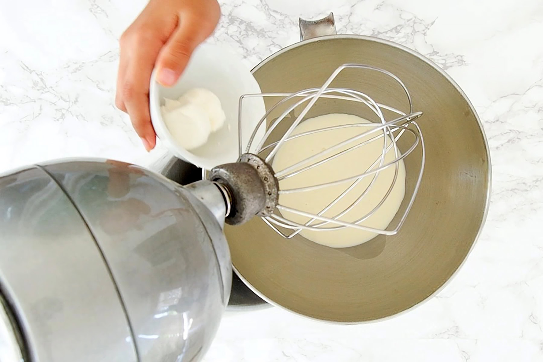 Whipping the cream.
