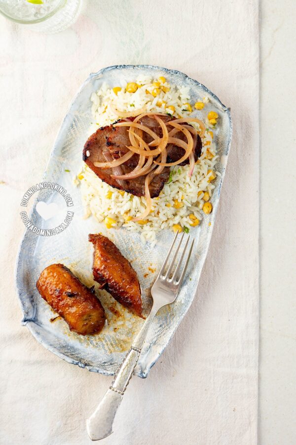 Dominican bistec encebollado (beef steak with onions).