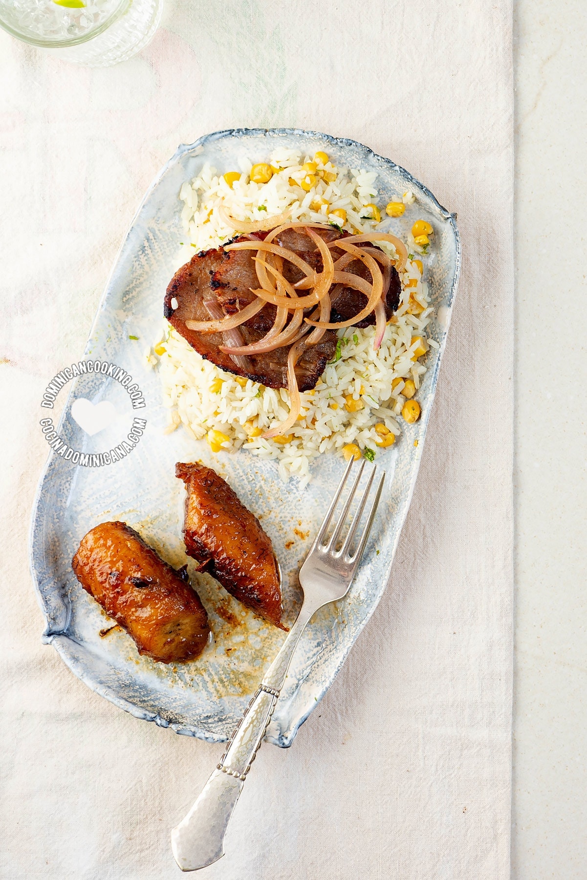 Dominican bistec encebollado (beef steak with onions).