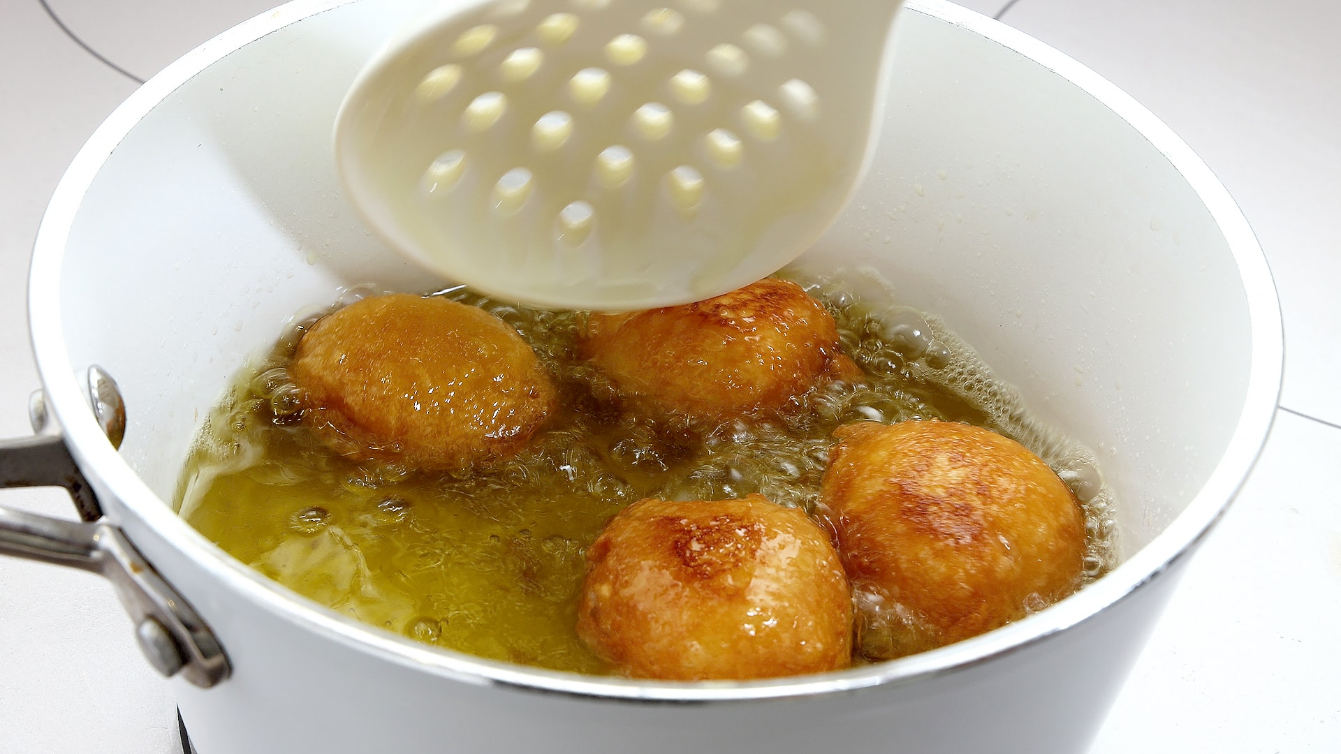 Frying dough.