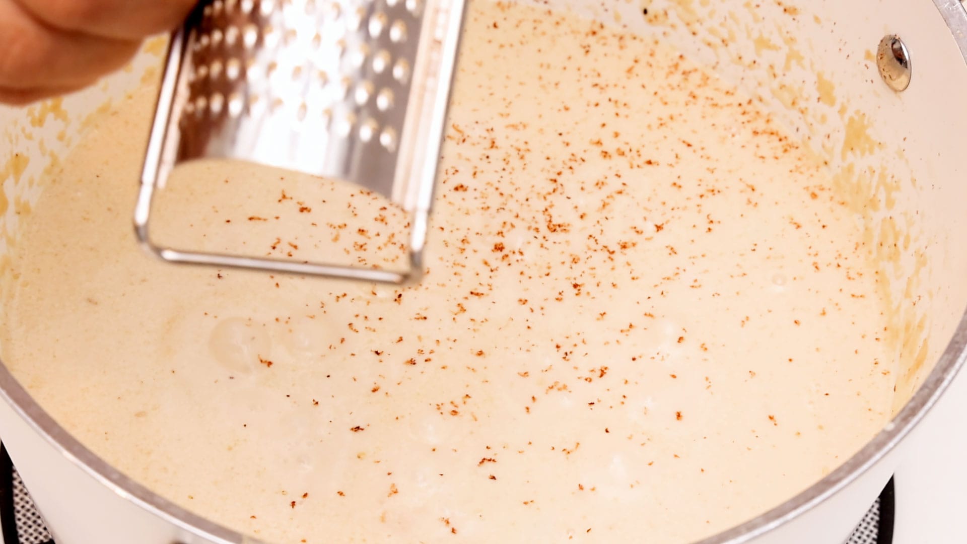 Adding nutmeg.