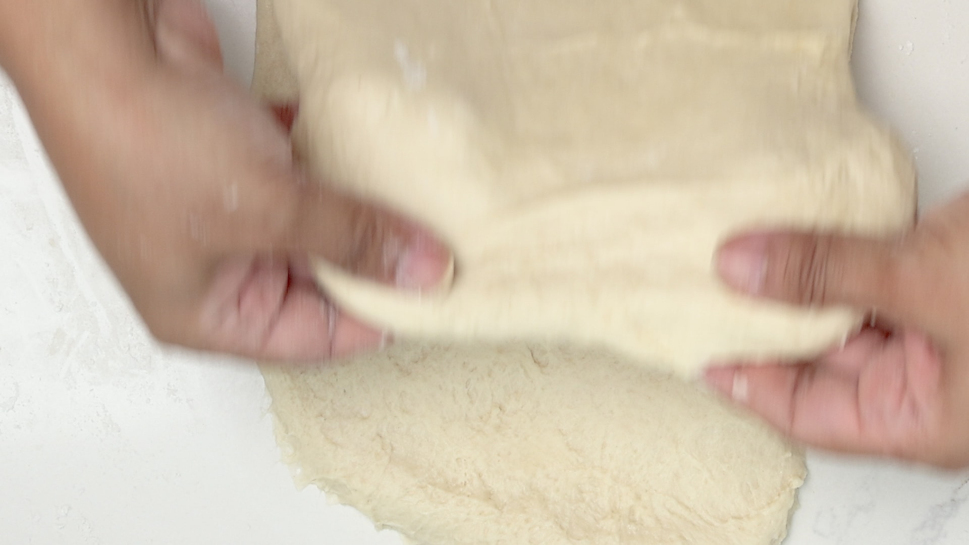 Folding dough.