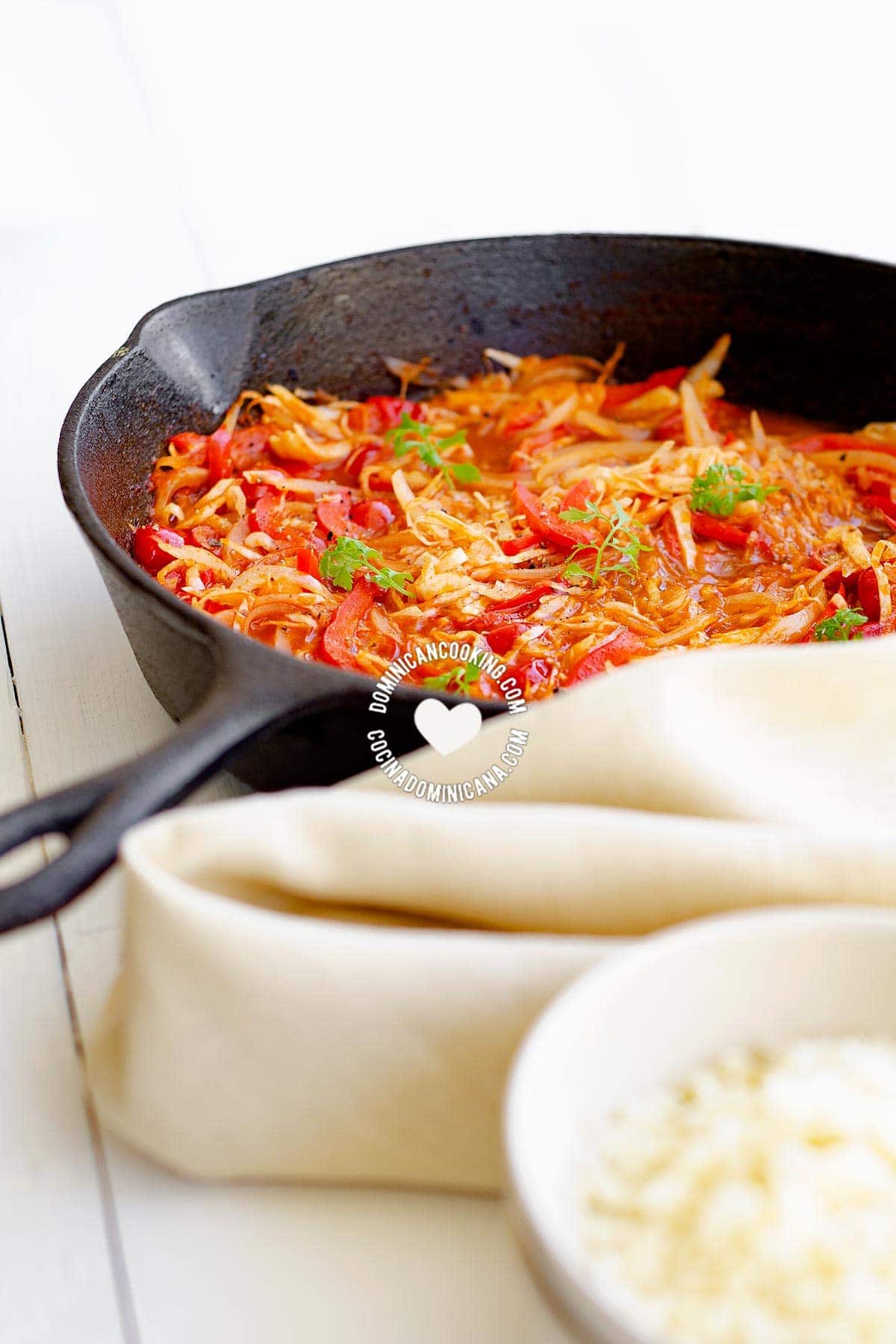 Skillet with repollo guisado (stewed cabbage).