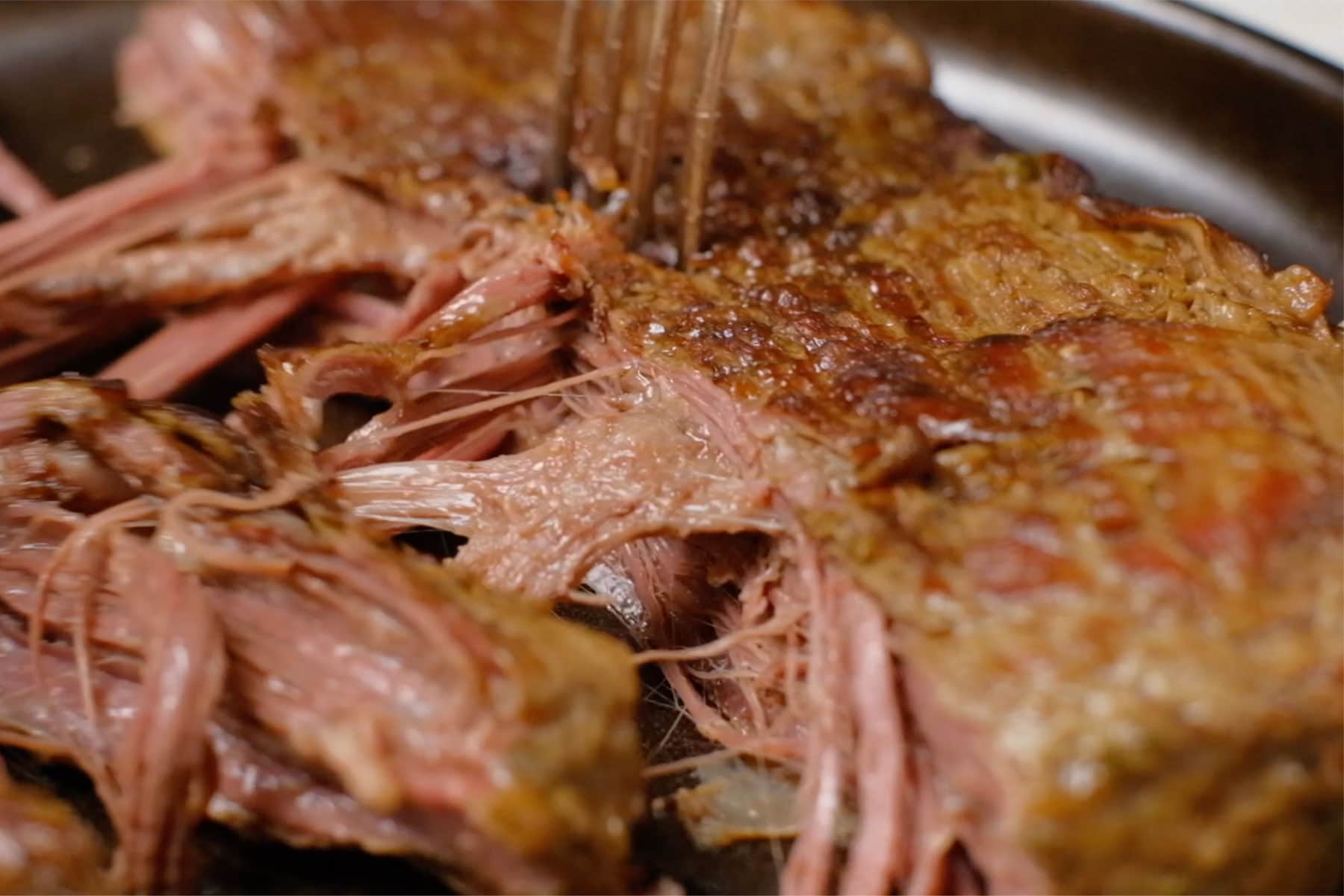 Shredding beef.