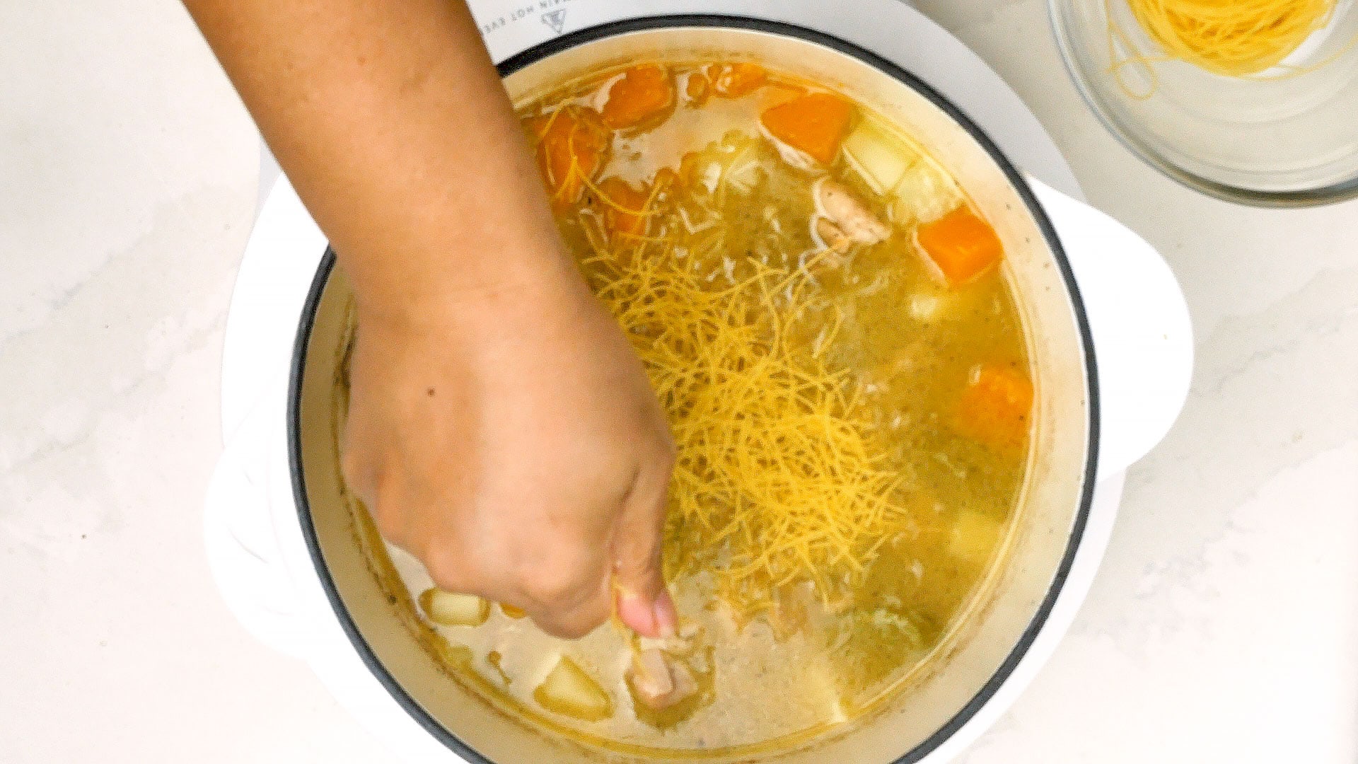 Adding noodles.