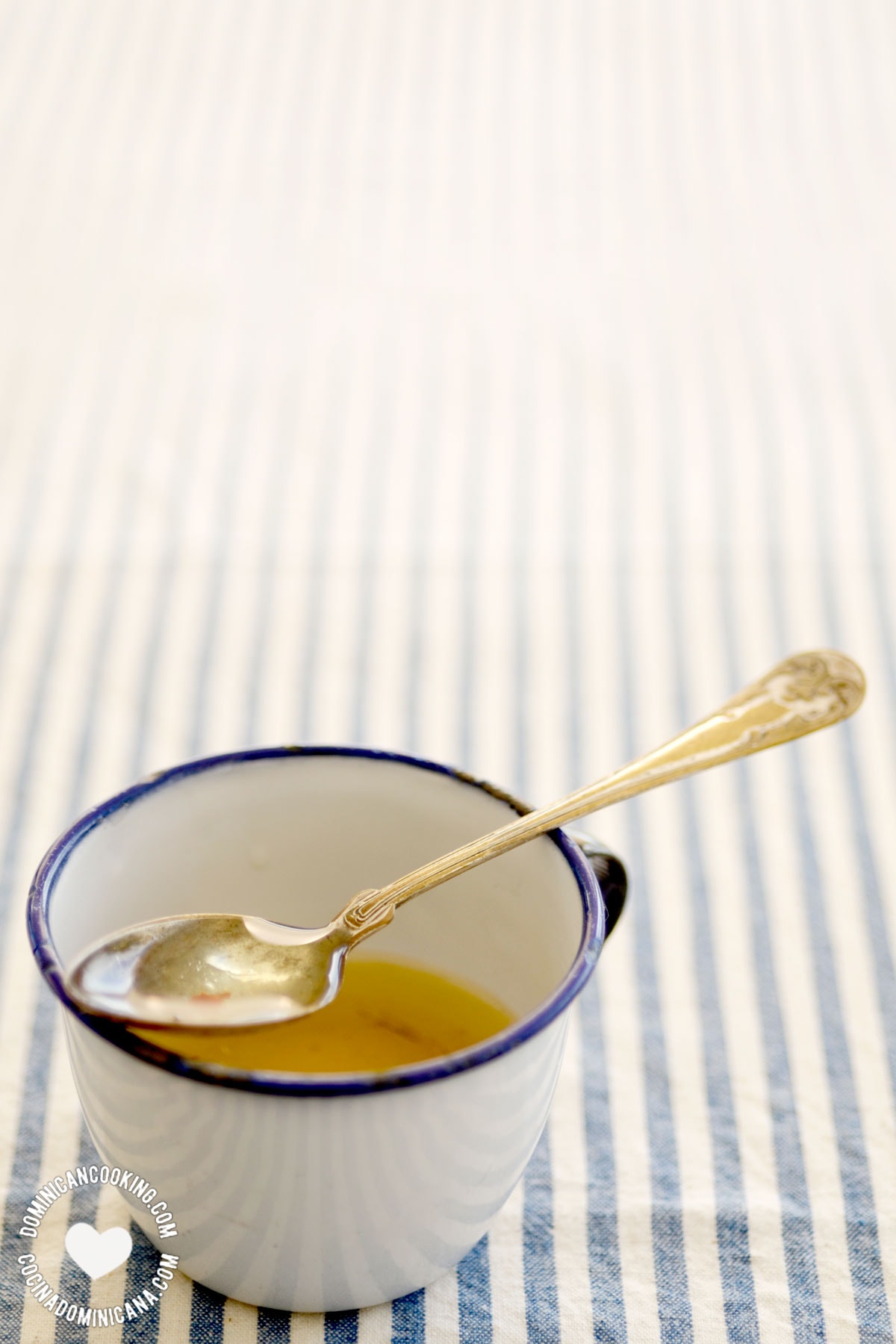 Vinaigrette in cup with spoon.